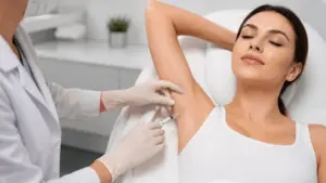 Patient receiving underarm hyperhidrosis treatment in Peoria, AZ to reduce excessive sweating with injectable therapy